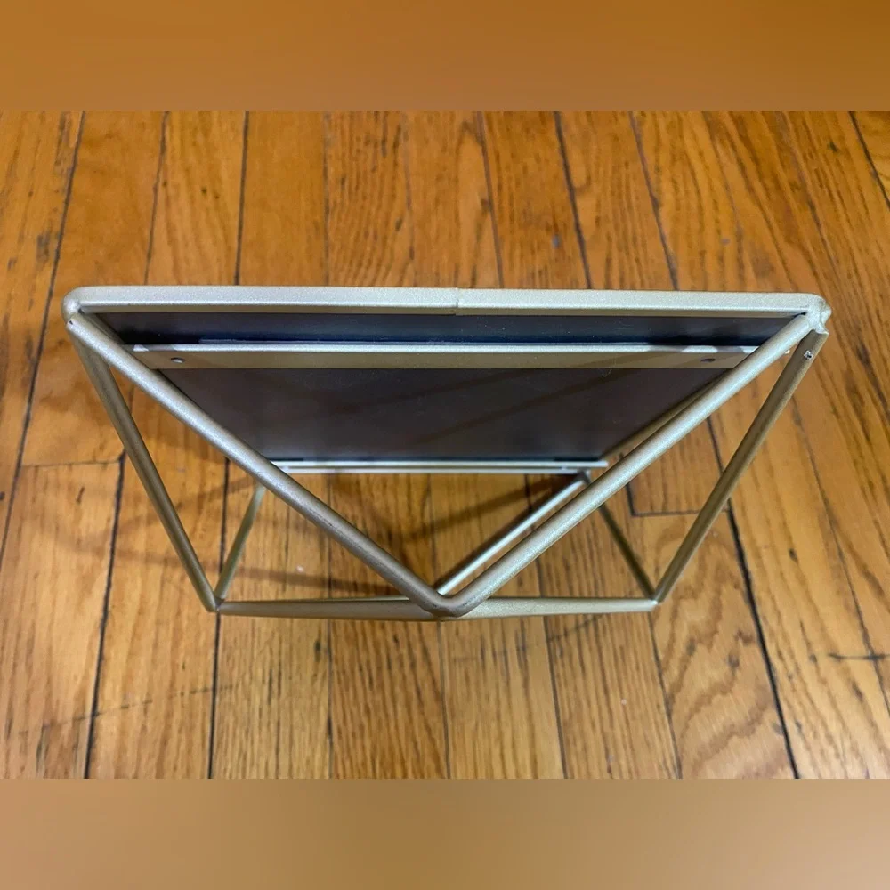 Mirror with geometric metalwork